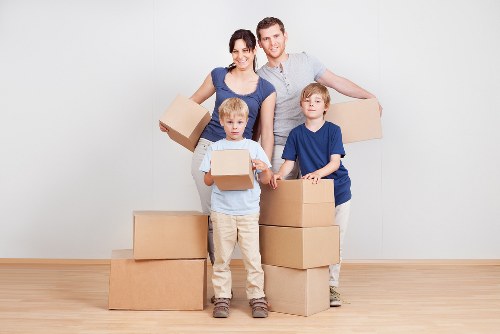 Professional office removals in Tokyngton with packed boxes and moving equipment