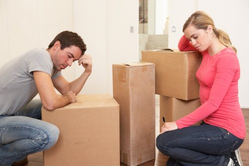 A mover carrying furniture during a small removals job